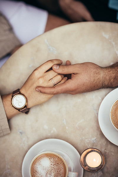 Top view of hands of a couple holding each other