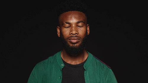 Portrait of african man with eyes closed