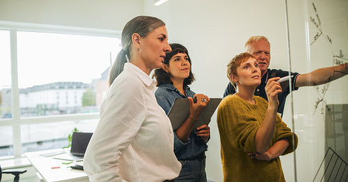 Team studying new project details in meeting