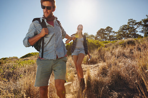 Young man on a hiking trip with his girlfriend