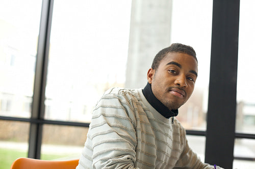 Young african american student at library
