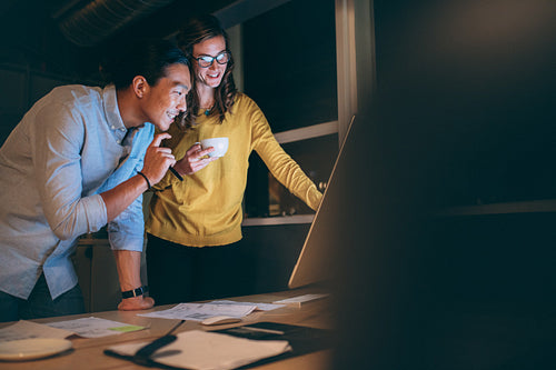 Business colleagues working late night in office