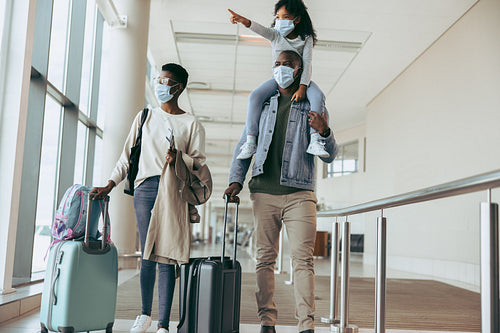 Family at airport during pandemic