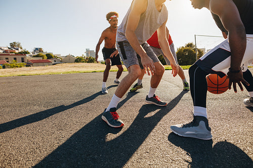 Men playing basketball
