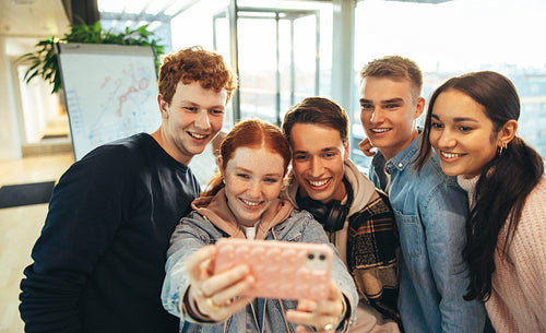 Young people taking selfie in college campus
