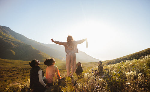 Group hiking under the sunny mountains