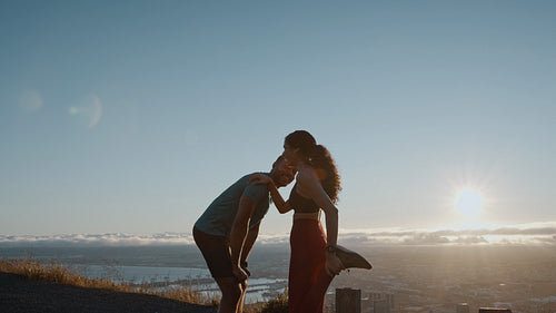 Couple resting and stretching after a morning run
