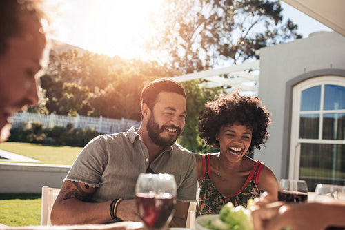 Young friends having lunch outdoors