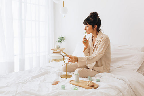 Woman doing skin care at home