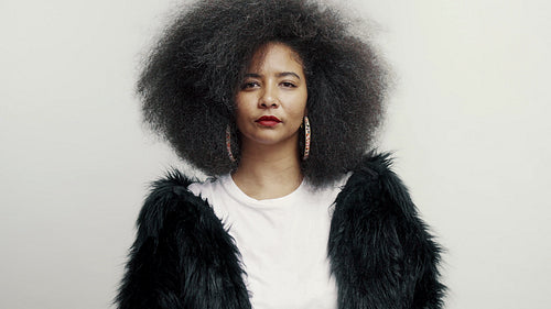 Smiling woman with afro hairstyle