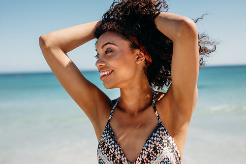 Portrait of a woman standing at the beach