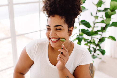 Woman doing skin care at home