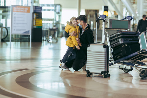 Mother and son waiting at airport