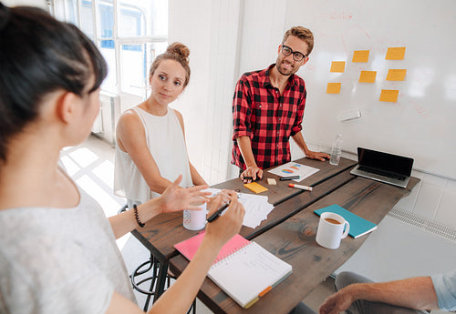 Business people discussing in meeting room at creative office