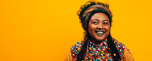 Ethnic woman wearing traditional clothing in a studio