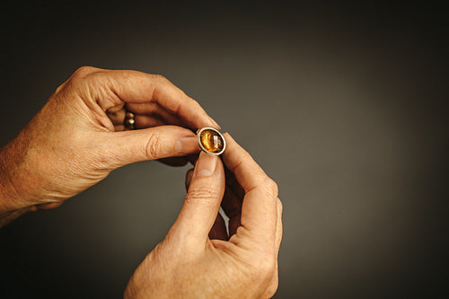 Jeweler inspecting a gemstone ring