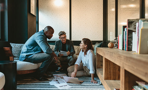 Marketing team discussing new project in creative office