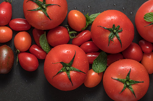 Tomatoes and mint on table