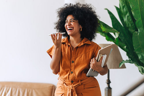 Happy businesswoman taking a phone call in an office