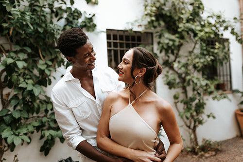 Young couple smiling at each other affectionately