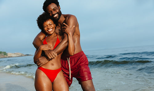 Young couple enjoying summertime at the beach