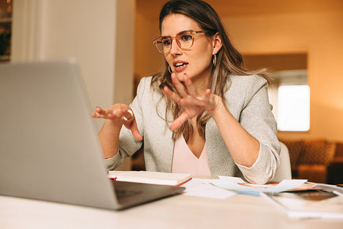 Smart interior designer explaining her plans during an online me