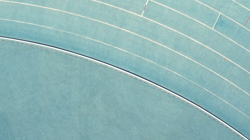 Sprinter practicing with parachute attached on back