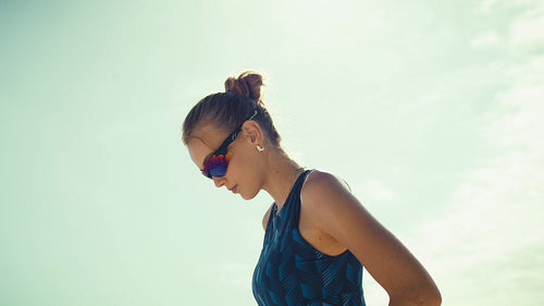 Handheld shot of a female beach volleyball player concentrating during a match