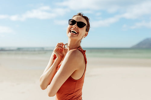 Tourist woman standing on beach