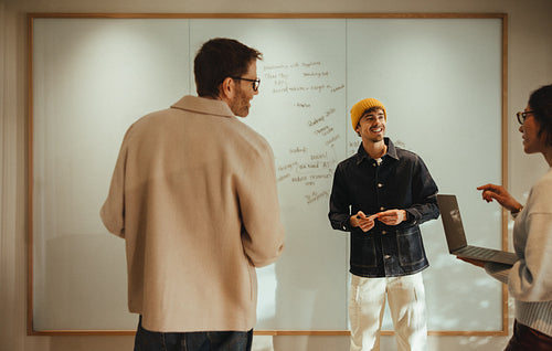 Strategy development: team working through ideas at the whiteboard