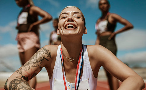 Female runner enjoying the success after winning the race