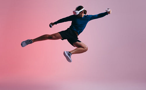 Young man practicing martial arts in virtual reality