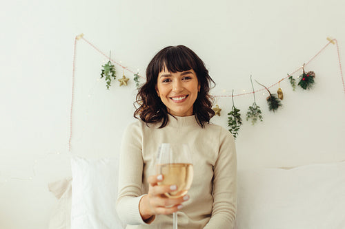 Portrait of smiling woman holding wine