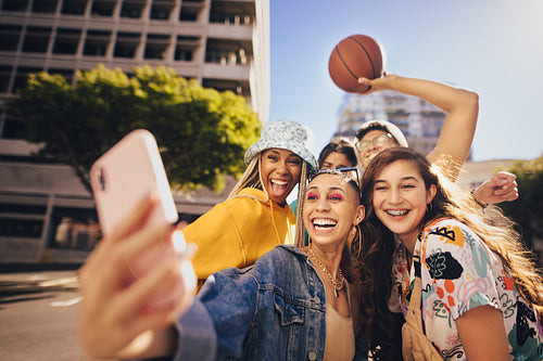 Group of friends taking a selfie outdoors