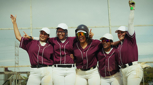 Women's baseball team celebrates a triumphant victory