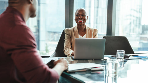 Female recruiter having a discussion with a job candidate in a professional interview