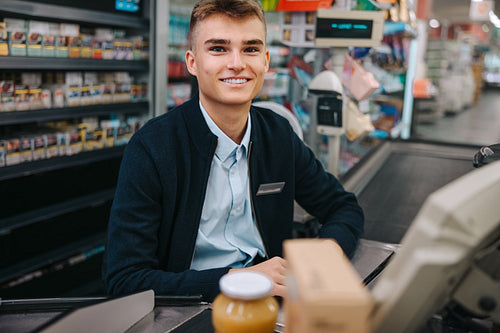 Cashier at supermarket checkout