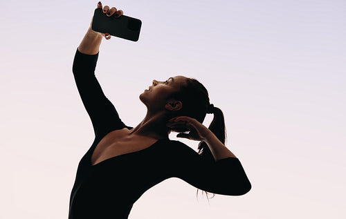 Immersed in the digital world: A dancer navigating the cyber world with her smartphone