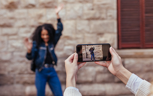 Woman posing for photos outdoors