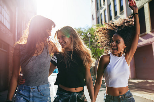 Group of friends enjoying outdoors on city street