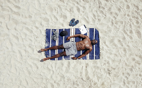 African male model sunbathing
