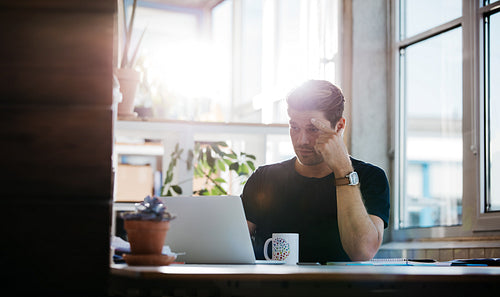Serious young man finding ideas