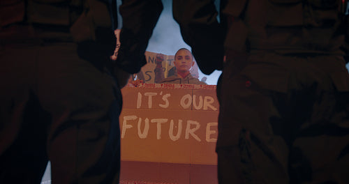 Protestors with banners demonstrating against security forces