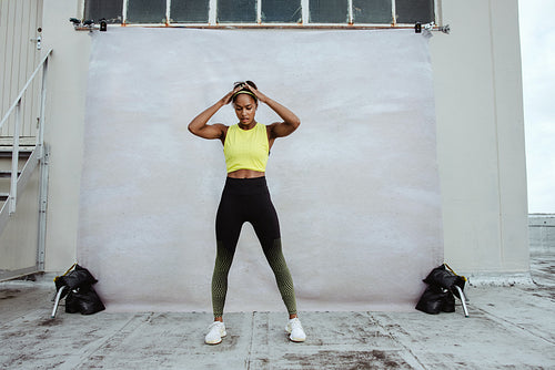 African female athlete exercising on rooftop