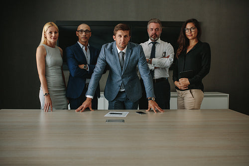 Confident corporate professionals in meeting room