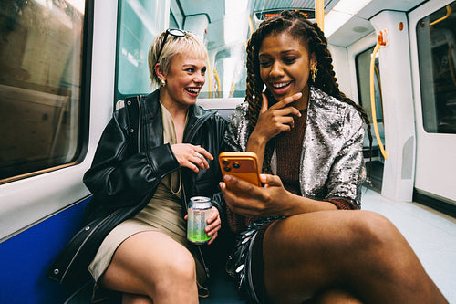 Friends laugh on the way to a party