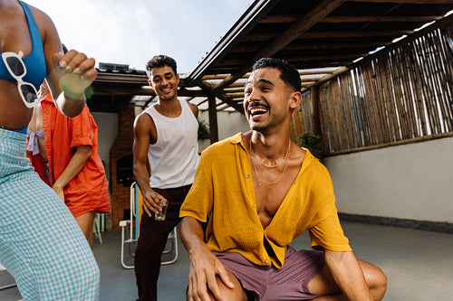 Friends dancing together during a joyful weekend gathering in Rio de Janeiro