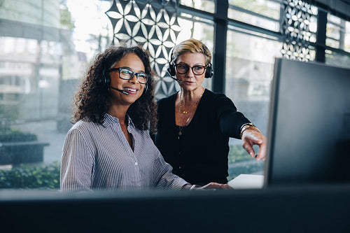 Businesswomen cooperating working in a call center