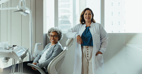 Dentist and patient in a supportive consultation within dental clinic