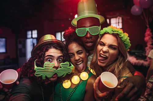 Friends having amazing celebration of St.Patrick's day at pub